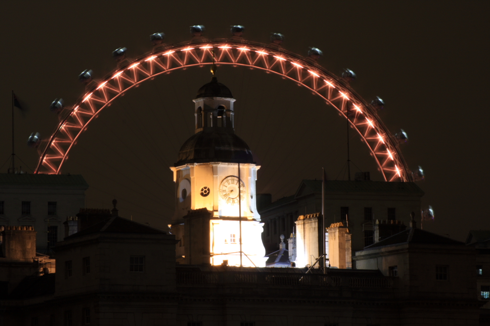 The London Eye forming a halo over the clock tower at Horse Guards Parade