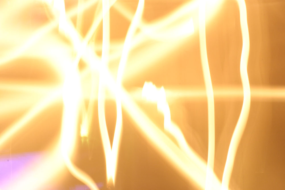 Candles in front of a gas fire taken on a long exposure with the camera being moved relatively fast.