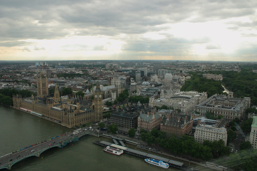 Houses of Parliament as seen from the London Eye. Look in the background and you can see Battersea power station behind the Houses of Parliament and Buckingham Palace beyond St James Park on the right.